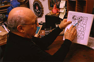 Photo of E.J. Gold demonstrating how to draw